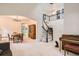 Spacious foyer with a staircase, chandelier, and open dining area at 7420 S Houstoun Waring Cir, Littleton, CO 80120