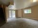 Finished basement with sliding glass door to the backyard and a window for natural light at 4115 S Vincennes Ct, Denver, CO 80237