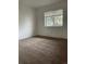 Bedroom with neutral carpeting and a window for natural light at 4115 S Vincennes Ct, Denver, CO 80237