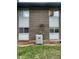 Brick exterior of the home shows the AC unit and windows at 4115 S Vincennes Ct, Denver, CO 80237