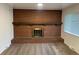 Close-up of the brick fireplace in the living room at 4115 S Vincennes Ct, Denver, CO 80237