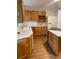 Bright kitchen with wood cabinets, laminate countertops, and matching appliances at 4115 S Vincennes Ct, Denver, CO 80237