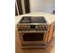 Stainless steel Frigidaire oven and cooktop set in a kitchen island at 4115 S Vincennes Ct, Denver, CO 80237