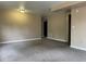 Inviting living room with neutral paint, carpeted flooring, and ample space for entertaining at 4115 S Vincennes Ct, Denver, CO 80237