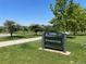 Outdoor image of Rosamond Park sign surrounded by green grass and scattered trees at 4115 S Vincennes Ct, Denver, CO 80237