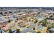 Aerial view capturing the neighborhood with tree lined streets and surrounding city landscape at 940 S Geneva St, Aurora, CO 80247