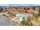 An aerial view of a home with a large lot, detached garage and RV parking at 940 S Geneva St, Aurora, CO 80247