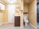 Basement bathroom with modern vanity, toilet, and tiled shower at 940 S Geneva St, Aurora, CO 80247