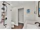 Bathroom with a sleek vanity, bronze shower fixtures and neutral tones at 940 S Geneva St, Aurora, CO 80247