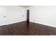 Simple bedroom features wood floors and a barn door for a stylish and functional space at 940 S Geneva St, Aurora, CO 80247