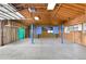 Large garage space with unfinished walls and ceiling, offering ample storage space at 940 S Geneva St, Aurora, CO 80247