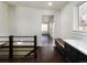Upstairs landing features a dark wood railing and a built in desk for convenience at 940 S Geneva St, Aurora, CO 80247