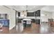 Modern kitchen with gray cabinets, a white countertop island, and stainless steel appliances at 940 S Geneva St, Aurora, CO 80247