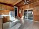 Vintage eat-in kitchen with wood walls, tiled floor, white appliances, and lots of cabinet space at 940 S Geneva St, Aurora, CO 80247