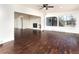 Bright living room featuring hardwood floors, fireplace, and large windows at 940 S Geneva St, Aurora, CO 80247