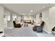 Spacious living room with neutral-toned walls, recessed lighting, and comfortable seating at 940 S Geneva St, Aurora, CO 80247