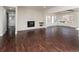 Spacious living room featuring a fireplace, large windows, and elegant hardwood floors at 940 S Geneva St, Aurora, CO 80247