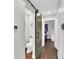 Charming powder room featuring a sliding barn door and modern fixtures at 940 S Geneva St, Aurora, CO 80247