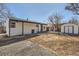 Large backyard features an outbuilding, gravel bed, and well-maintained exterior at 4611 W 2Nd Ave, Denver, CO 80219