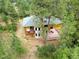 Aerial view of house, deck, and surrounding trees at 7350 Fremont Pl, Larkspur, CO 80118