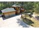 Two-story log home with large yard and circular driveway at 7350 Fremont Pl, Larkspur, CO 80118