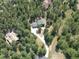 Aerial view of house and lot in wooded area at 7350 Fremont Pl, Larkspur, CO 80118