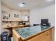 Basement wet bar with tile counters and mirrored backsplash at 7350 Fremont Pl, Larkspur, CO 80118