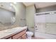 Simple bathroom with a shower/tub combo and wood vanity at 7350 Fremont Pl, Larkspur, CO 80118