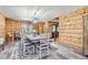 Spacious dining area with a wooden table and bench at 7350 Fremont Pl, Larkspur, CO 80118