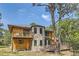 Log home with stone accents, deck, and mountain views at 7350 Fremont Pl, Larkspur, CO 80118