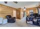 Home office with a comfortable chair and built-in shelving at 7350 Fremont Pl, Larkspur, CO 80118