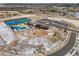 Aerial shot showcasing community amenities, including tennis courts, pool, clubhouse, parking, and landscaping at 22580 E Eads Cir, Aurora, CO 80016