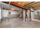 Unfinished basement with exposed ductwork and wooden frame against concrete walls at 22580 E Eads Cir, Aurora, CO 80016