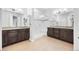Spacious bathroom with double vanities, modern lighting, and large glass enclosed shower at 22580 E Eads Cir, Aurora, CO 80016
