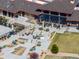 Aerial view of community center with outdoor seating, landscaped gardens, and inviting amenities at 22580 E Eads Cir, Aurora, CO 80016