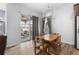 Bright dining area with chandelier lighting and sliding glass doors to the patio at 22580 E Eads Cir, Aurora, CO 80016