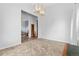 Bright dining room leads to carpeted living area with natural light at 22580 E Eads Cir, Aurora, CO 80016