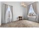 Bright dining room featuring large windows with nice sheer curtains and a modern chandelier at 22580 E Eads Cir, Aurora, CO 80016