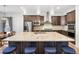 Spacious kitchen with granite countertops, pendant lighting, stainless steel appliances, and seating at the island at 22580 E Eads Cir, Aurora, CO 80016