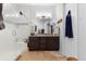 Spacious bathroom featuring a glass-enclosed shower, vanity with double sinks, and tile flooring at 22580 E Eads Cir, Aurora, CO 80016