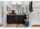 Main bathroom with double sinks, vanity, glass enclosed shower, and modern fixtures at 22580 E Eads Cir, Aurora, CO 80016