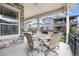 Charming covered patio with comfortable seating area, perfect for outdoor dining and relaxing at 22580 E Eads Cir, Aurora, CO 80016