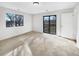 Bright bedroom with carpeting, large window, and sliding door to balcony at 9010 W 88Th Cir, Westminster, CO 80021