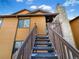 Front view of the townhome showcasing stairs leading to the entrance at 9010 W 88Th Cir, Westminster, CO 80021