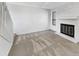 Living room with a fireplace and neutral carpet at 9010 W 88Th Cir, Westminster, CO 80021