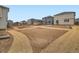 New construction homes feature prepped backyards ready for landscaping at 553 Homestead Ave, Brighton, CO 80601