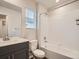 Bathroom features a white shower and vanity with gray cabinets at 553 Homestead Ave, Brighton, CO 80601