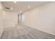 A bright, carpeted bonus room with neutral paint, a walk-in closet and natural light at 553 Homestead Ave, Brighton, CO 80601