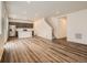 Open-concept living area featuring hardwood floors, recessed lighting, and a modern kitchen at 553 Homestead Ave, Brighton, CO 80601