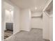 Bright walk-in closet featuring carpet, and included shelves and bars at 553 Homestead Ave, Brighton, CO 80601